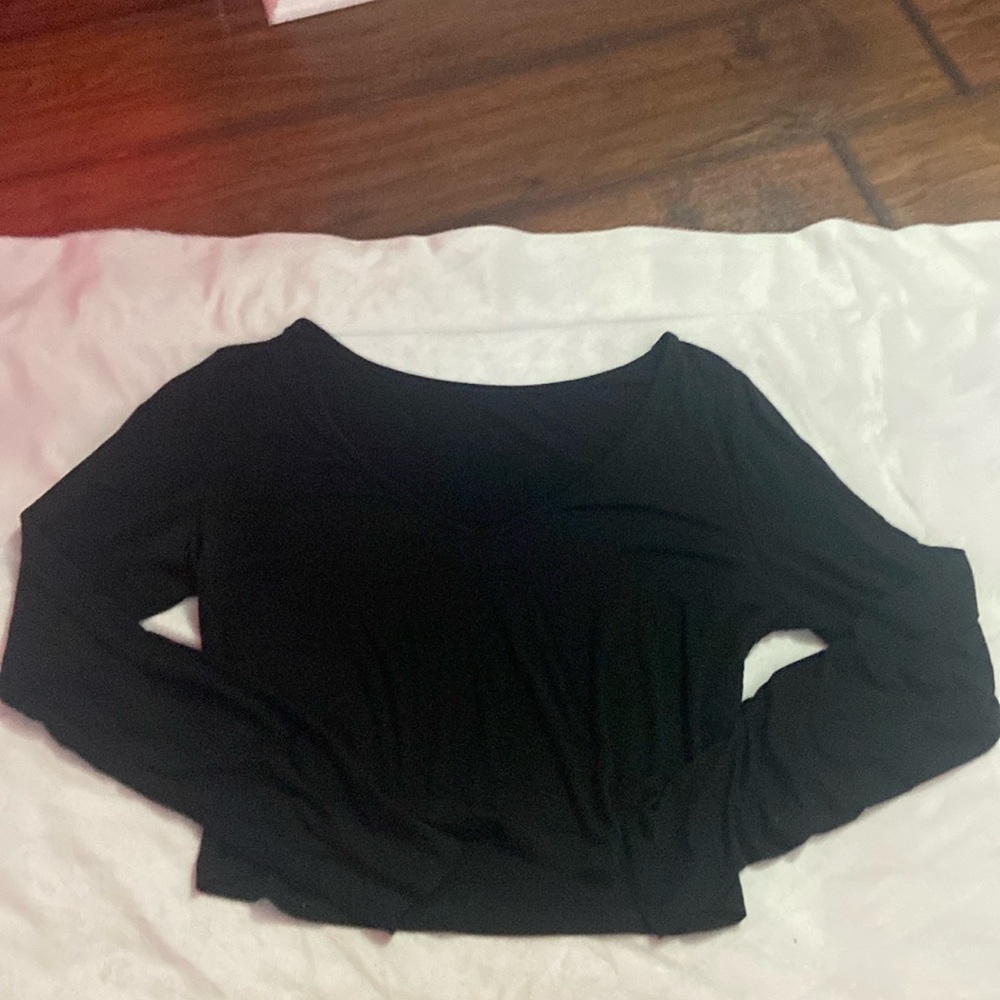 White, Brown, and Black long sleeve crop shirts came in a set
